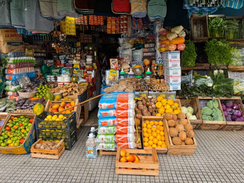 A vegetable shop seen from the sidewalk with boxes of fruit and spices in Liniers Buenos Aires