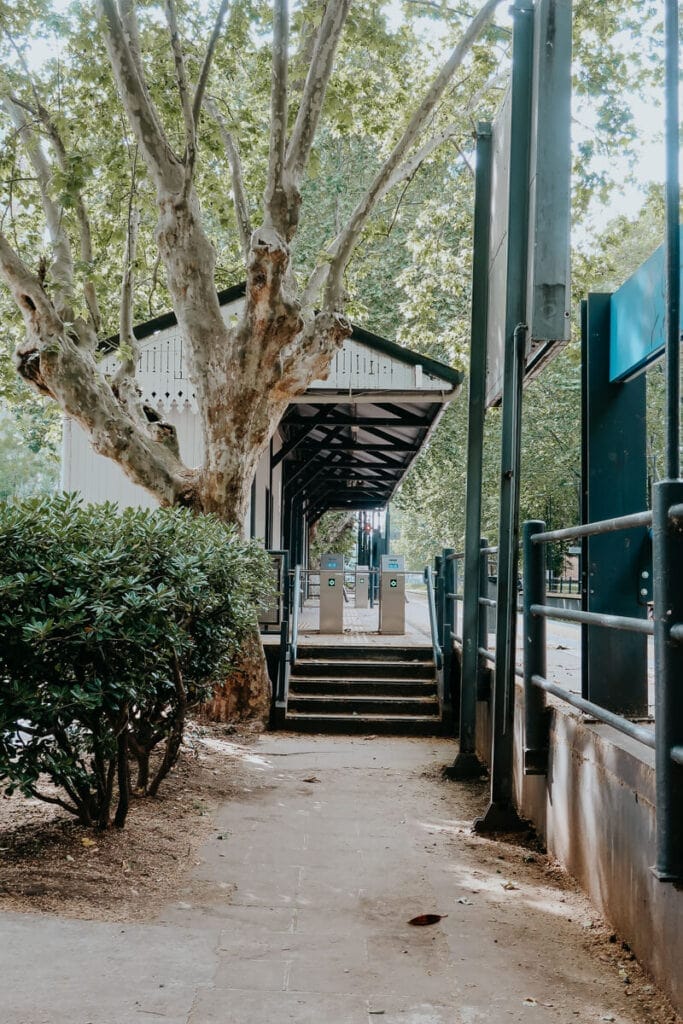 A grey building and train platform