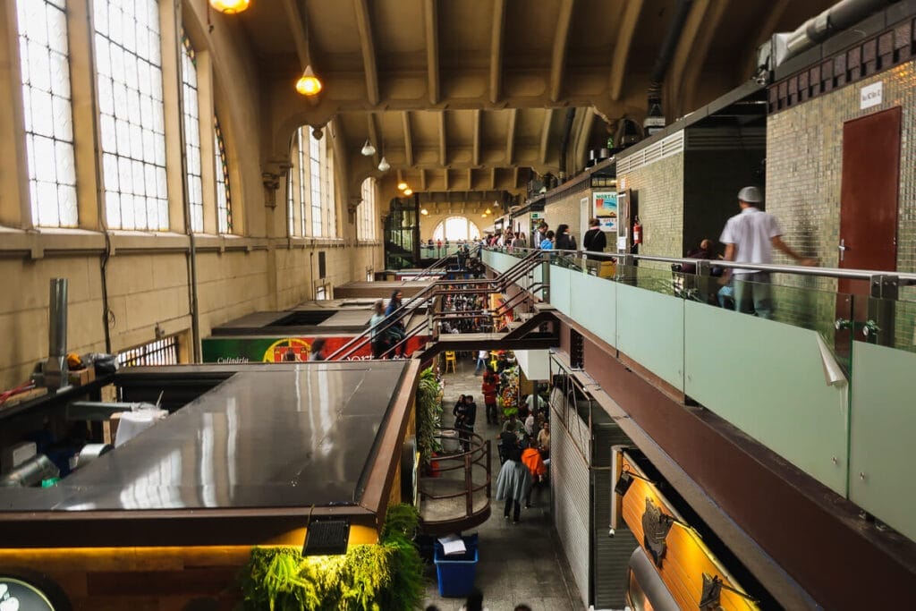 An indoor market filled with stalls seen from above