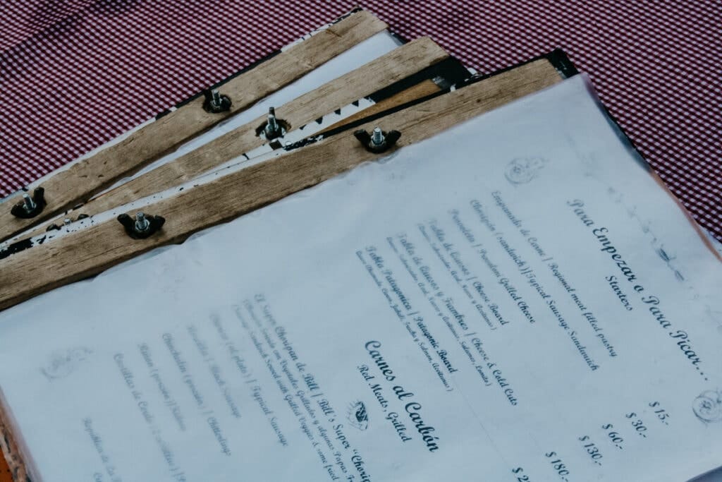 Three menus on a red checkered table