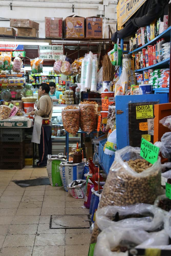 Market stalls selling cleaning products and food