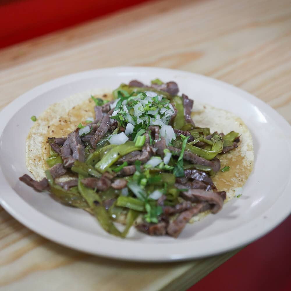 A taco with meat and nopales