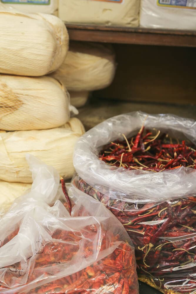 Two plastic bags filled with red chili peppers