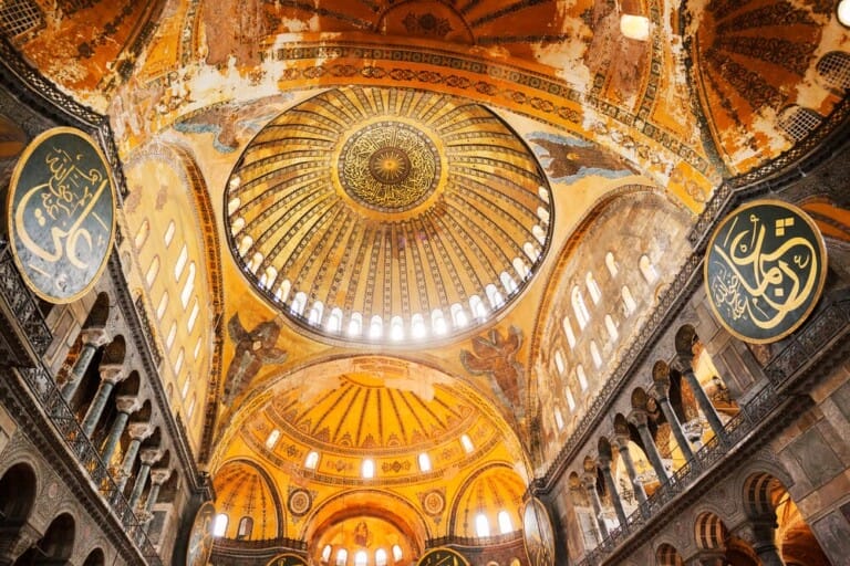 Golden domes and columns inside a mosque