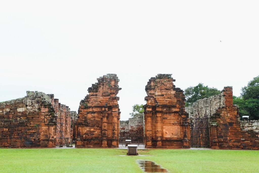 Red stone ruins of a mission in the jungle