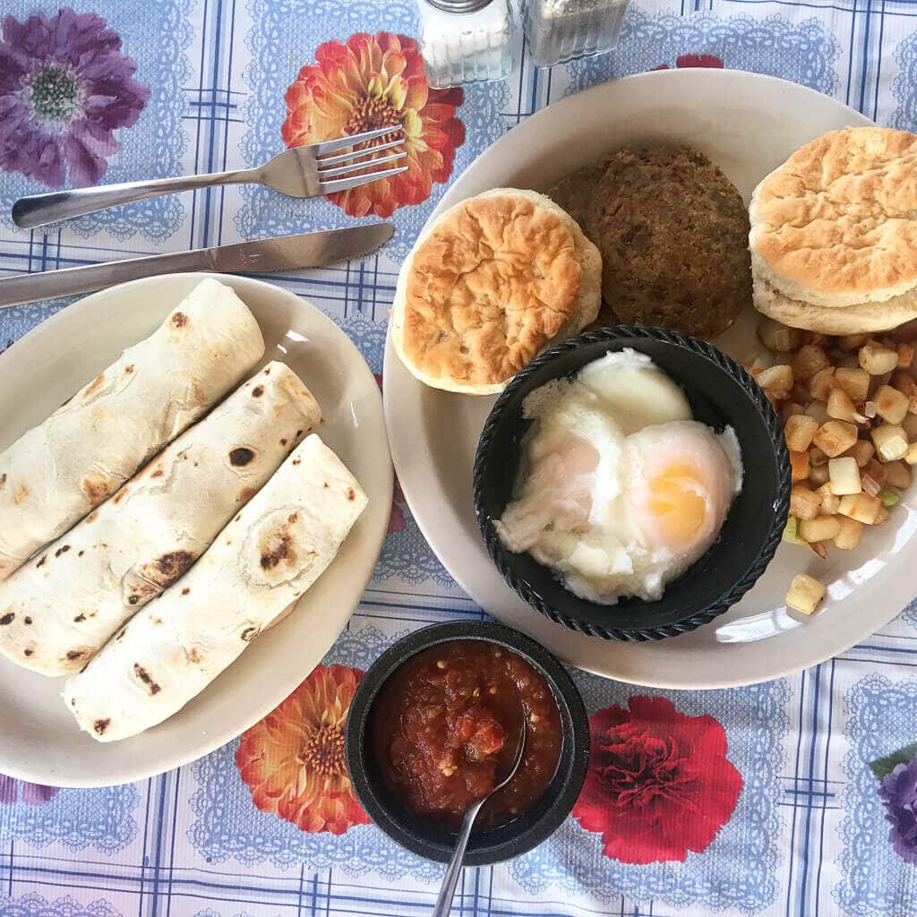 Tacos and breakfast eggs on a colorful tablecloth