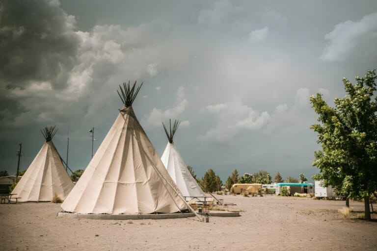 Three teepees in the desert