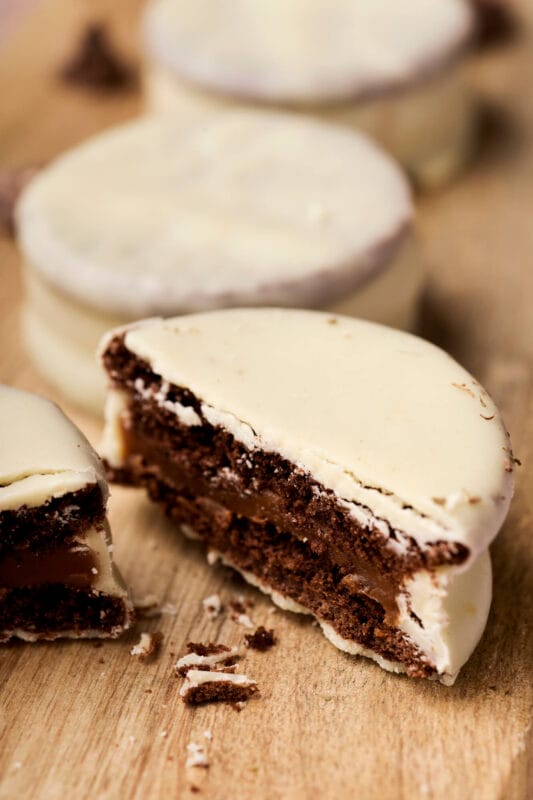 Half of a chocolate cookie bathed in white chocolate