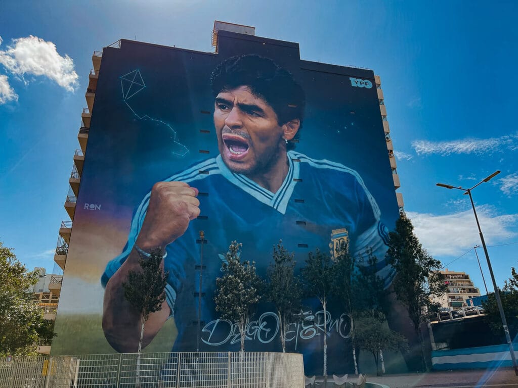 A mural of Maradona covers an entire apartment building in Constitucion Buenos Aires