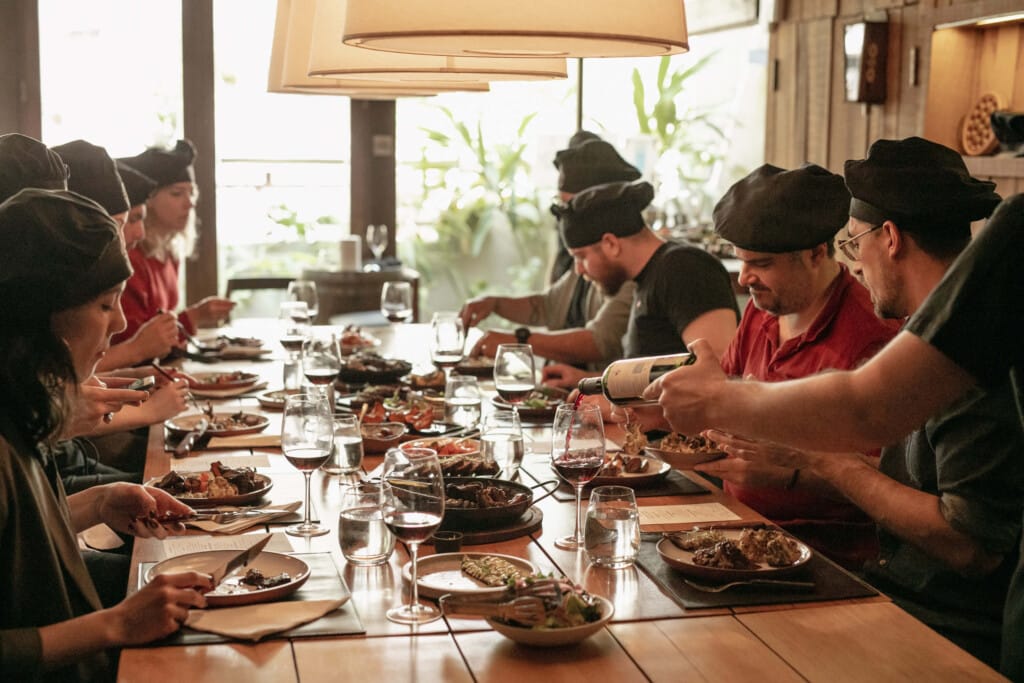 Diners eat a communal table 