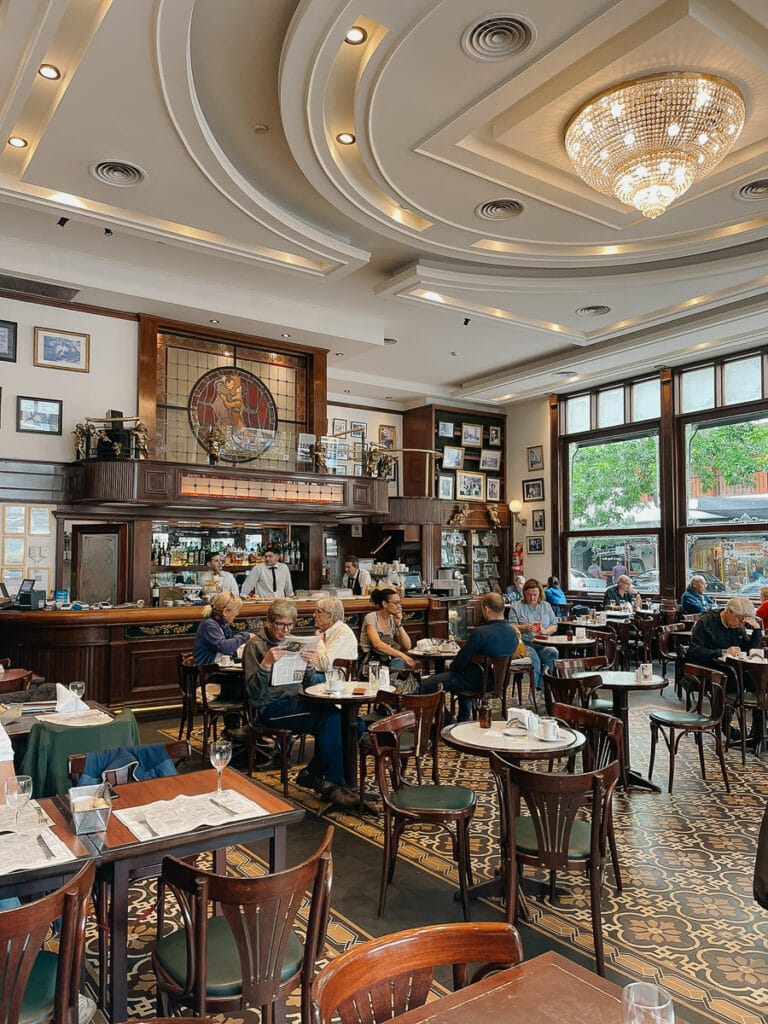 Diners have coffee and chatter in a historic Buenos Aires cafe