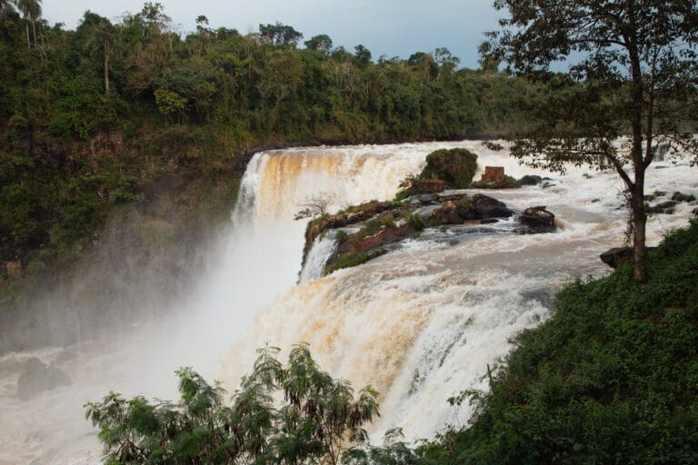 The Monday river pours over the cliff of Saltos del Monday in Paraguay